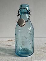 Front view showing embossed wording, stopper attached