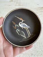Front view of Ruscha dish showing painted heron motif