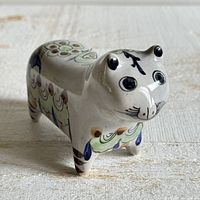 angled view showing overall cat form and painted top decoration