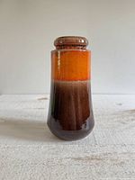 Front view of Scheurich orange and brown lava glaze vase