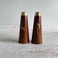 Front view of both wooden shakers displaying gold S and P letters