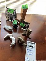 All eight animal figures displayed on table