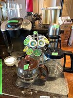 Full lot showing Keurig brewer, carousel, thermos, carafes, sugar bowl