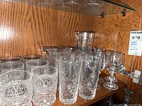 Cabinet shelf with various crystal glasses and jug displayed