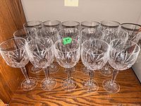 Full set of 16 crystal goblets on shelf