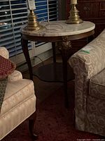 Full view of round end table beside sofa