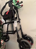 Overall view of black Nexus rollator walker folded
