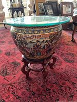 Fishbowl planter on wooden stand with glass top, full view