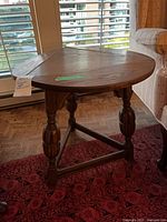 Table with one leaf lowered showing triangular shape