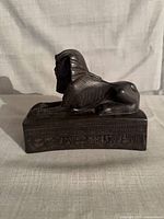 Side view showing full sphinx profile and hieroglyphic relief