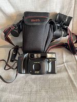 Front view of Fuji PL-800 camera with Black’s case and leather pouch