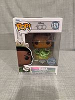 Front view of boxed Funko Pop! Tiana figure showing character, Diamond Collection and Funko.com Exclusive stickers