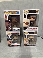 Front view of four boxed Funko Pop! figures