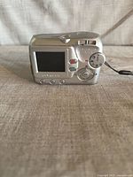 rear view showing LCD, controls, and strap