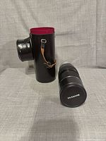 Lens, cap and closed hard case upright