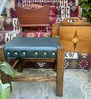 Group view of footstool and two magazine racks