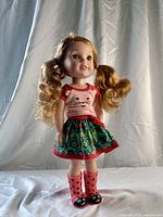 Full front view of Willa doll standing, showing outfit and boots