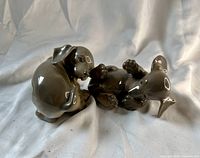 Both dachshund figurines side by side