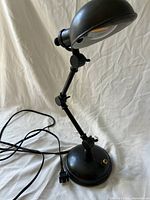 Full view of lamp showing joints, base, cord