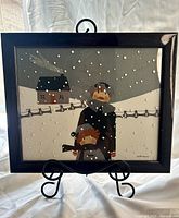 Framed artwork on stand showing full composition