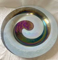 Full view of round iridescent glass plate