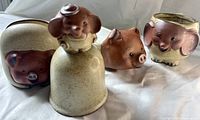 Front view of all four animal stoneware items