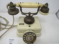 Front angled view showing full phone with cord