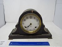 Front view of Sessions mantel clock with ruler for scale