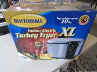 Front of retail box showing Butterball Indoor Electric Turkey Fryer XL and capacity info