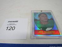 Full view of Joe Namath football card beside lot number card