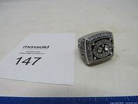 Overall shot of ring with MaxSold card