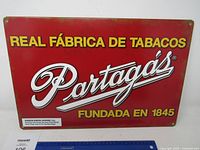 Full front view of the Partagás metal sign