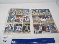 Two nine-pocket binder pages with 18 Pittsburgh Pirates cards