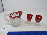 Pitcher and two glasses together with scale