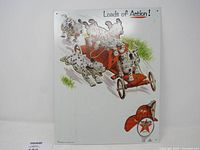 Full view of Texaco Dalmatian puppies metal sign