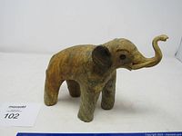 Full side view of carved wooden elephant