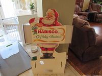 Front view of Nabisco Santa cardboard standee showing full figure and base