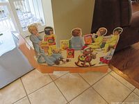 Full view of cardboard standee showing children holding Nabisco boxes