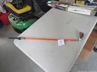 Full view of weighted golf club on table