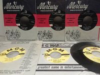 Three Mercury-sleeved Lesley Gore records and two MGM-sleeved Connie Francis records with an unsleeved MGM record in foreground