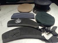 Group view of all six military headwear items