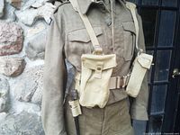 Full view of webbing on mannequin showing belt, pouches, braces and bayonet