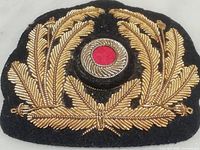 Front view of gold bullion embroidered wreath and cockade