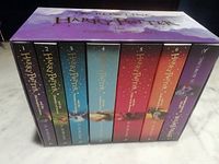 Front view of seven book spines within slipcase