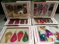 Front view of five boxes of ornaments and assorted loose ornament box