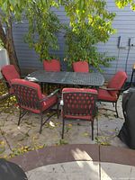 entire dining set table and six chairs under tree