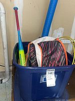 Blue tote containing Easton bat, pool noodle, backpack