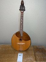 Full view of domra front showing body, neck, and headstock