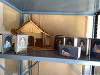 Overall view of wood stable and eight boxed Fontanini figurines on shelf