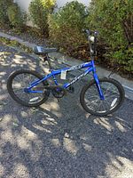 Full left side view of blue 20" Huffy Rock It bike